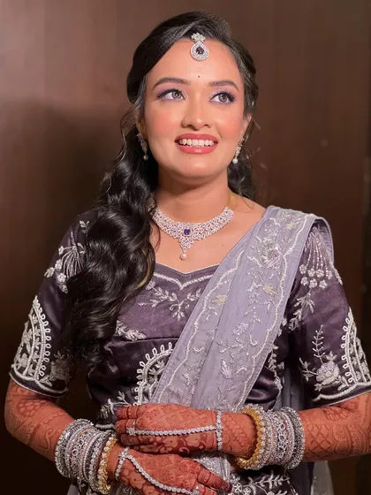A candid shot of the bride, her makeup looking perfect from every angle.
