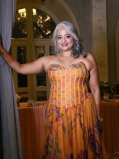 A stunning bridal cocktail look celebrating natural silver hair. I created soft waves and elegant makeup to complement her unique style for her special night.