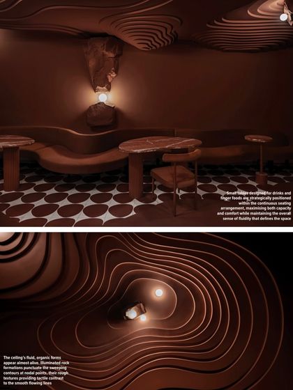 A detail shot from the magazine feature, showing the fluid, organic forms of the ceiling and the custom-designed tables.