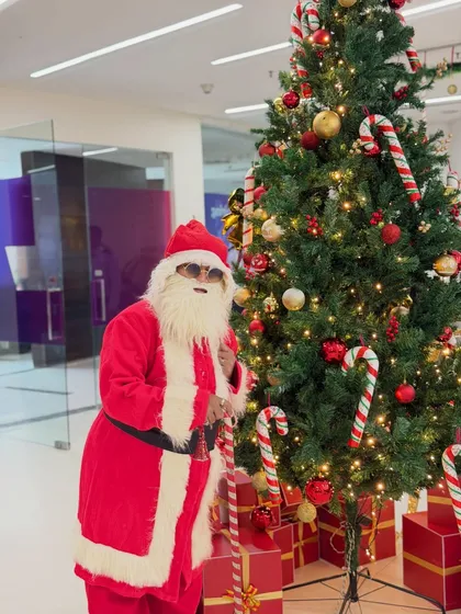 Ho ho ho! During Christmas, I love to become a magical Santa Claus. Here I am, ready to surprise guests at a corporate office party. It’s a fun way to bring festive cheer and a few tricks to holiday celebrations.