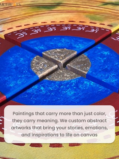 A close-up of the 'Brahmaand' artwork. This piece is more than just color on canvas; it carries meaning. The textured gold center and the deep blues and reds are part of a custom abstract work that brings a client's inspiration to life.