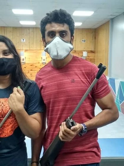 A couple enjoying a different kind of date activity at our shooting range. It's a great way to build focus and share a unique experience together.