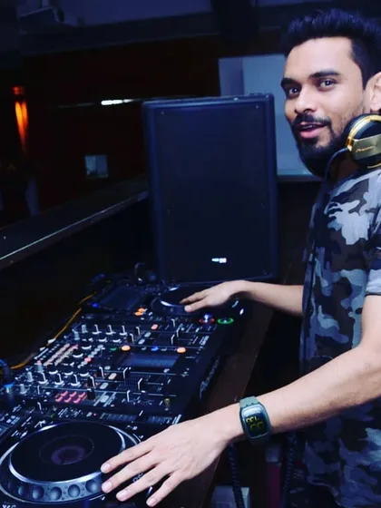 A quick pose between tracks. I bring a positive and energetic personality to every event I play.