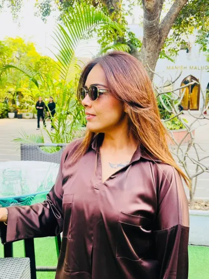 A candid moment while working. Even on busy days, I believe in slaying harder, and my outfit always reflects that mindset.