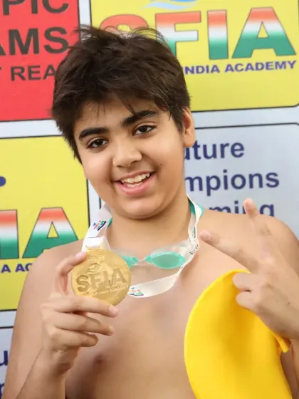 The joy of victory. One of our swimmers celebrating his gold medal at the Future Champions meet. This is what it's all about.