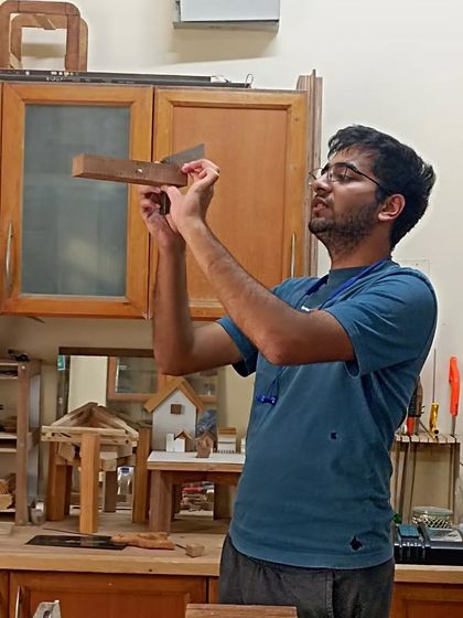 Nihal checking the fit of a mortise and tenon joint. This is a fundamental, strong joint that is used in all kinds of furniture construction.