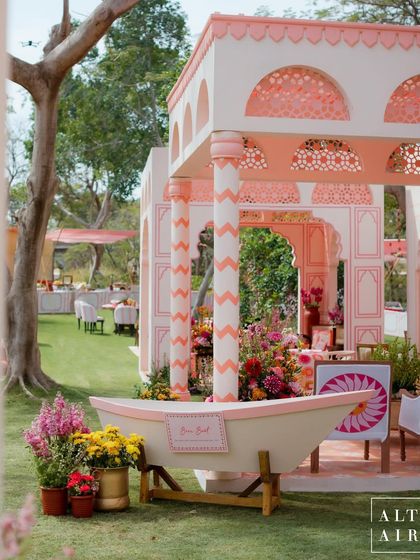 The 'Gulbahar' Holi party was designed to feel like a quintessential Rajasthan courtyard, but with a modern, quirky twist. I built this beautiful pavilion with intricate jaali work and chevron-patterned pillars, all in a fresh, happy pink palette.