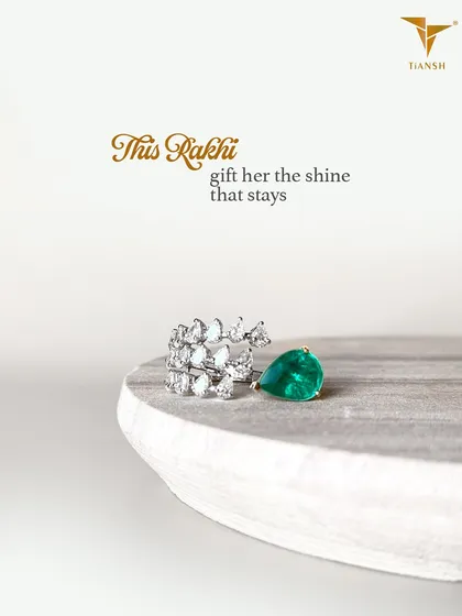 This Rakhi, gift her the shine that stays. This unique ring, featuring a pear-cut emerald and a cascade of diamonds, is a brilliant way to celebrate her.