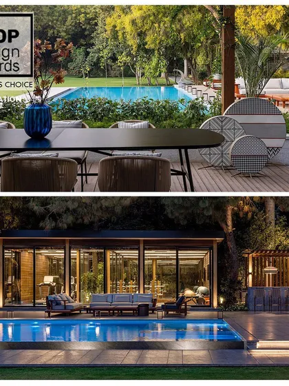 This view showcases the lifestyle we create, connecting a modern outdoor gym and poolside lounge at our award-winning farmhouse project. The design integrates wellness and leisure into the home's architecture, offering a private oasis for relaxation and fitness.