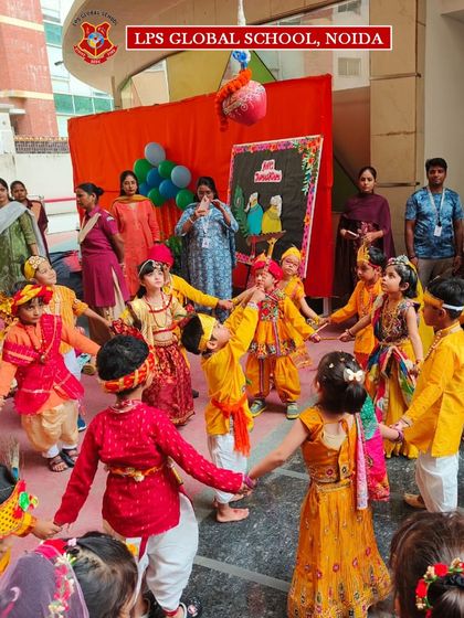 Students dressed as Radha and Krishna dance in a circle during our Janmashtami celebration. The 'Raas Leela' performance is a vibrant and joyful part of our cultural festivities.