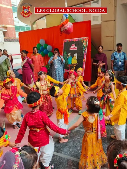 Students dressed in colorful traditional attire perform a dance during the Janmashtami celebration, filling the air with joy.