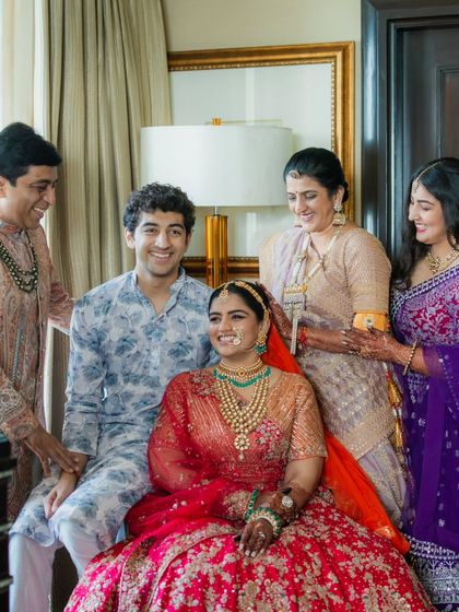 Another beautiful family moment. The genuine smiles and laughter are what make these photos so special. It's a joy to see the coordinated outfits come to life in such a happy setting.