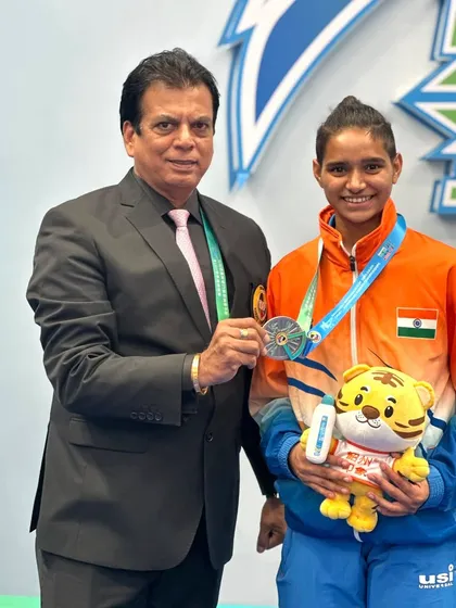 Presenting the silver medal to Ms. Rusha Tambat at the Asian Karate Championship. We support our junior players financially and technically to encourage their growth.
