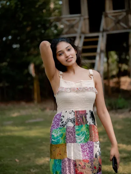A duplicate of image 221, this candid and joyful portrait of actress Rachana Inder in a park is full of natural beauty.
