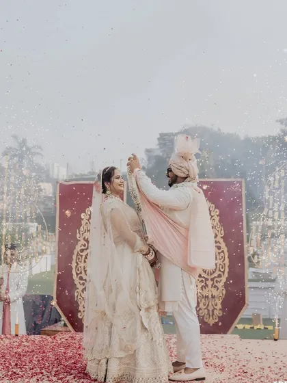 The couple celebrates their union with a dance on the varmala stage, as cold pyros sparkle around them. It's a moment of pure celebration and joy.