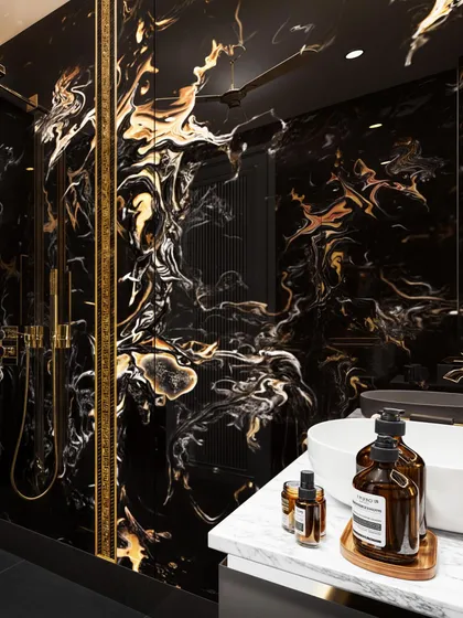 A dramatic washroom clad in black and gold marble. My rendering captures the fluid, lava-like pattern of the stone and the gleam of the gold fixtures.