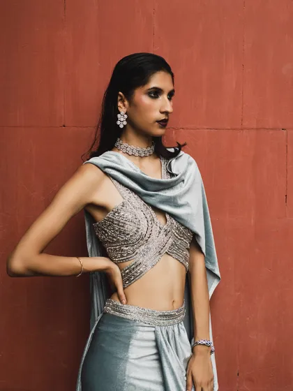 A closer look at the intricate beadwork on the blouse of the silver sari. I believe in focusing on high-quality craftsmanship when selecting festive pieces.