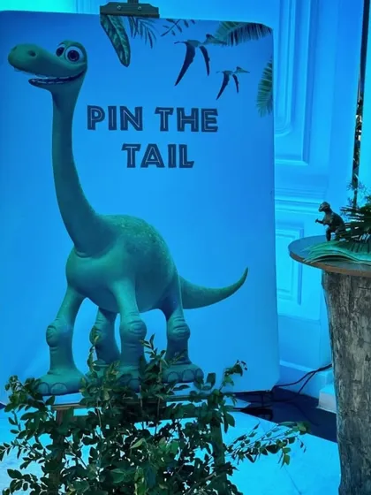 A "Pin the Tail on the Dinosaur" game, custom-printed for a dragon and dinosaur-themed event. It's a classic party game that we can adapt to fit any theme you can imagine.