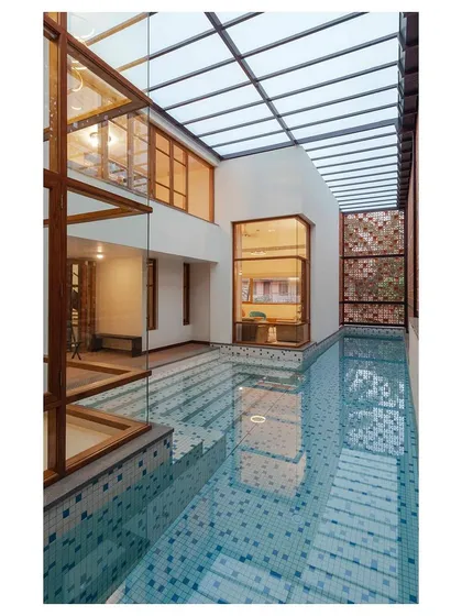 A lap pool is integrated into this home not just for recreation but as a climatic device. The water body helps to cool the adjacent living spaces through evaporation, demonstrating our use of passive design strategies.