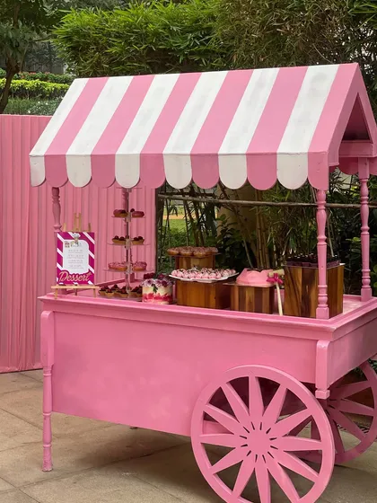 This custom pink cart was the centerpiece for a Barbie-themed party. I can arrange for themed carts and props to match your event's aesthetic perfectly.