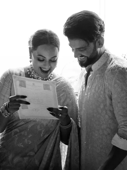 Sona and Zaheer joyfully look over their marriage certificate. This simple document represents a lifetime promise, and their smiles tell the whole story. We focus on these authentic moments of happiness.