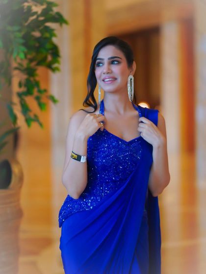 A close-up shot highlighting the sparkling halter-neck blouse and the confident expression I bring to glamorous events.