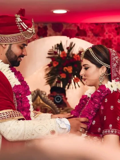 A moment from the Varmala ceremony, where the couple exchanges garlands, symbolizing their acceptance of each other.