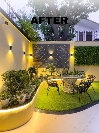 This cozy corner went from overlooked to inviting. We added a custom curved planter with built-in lighting, a vertical green wall, and a stylish jaali panel behind a tranquil water fountain.