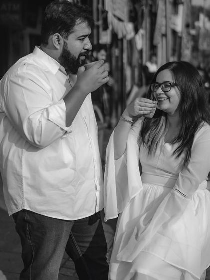 A pre-wedding shoot for food lovers in the heart of Chandni Chowk, Delhi. This black and white shot captures a candid moment over a cup of tea.