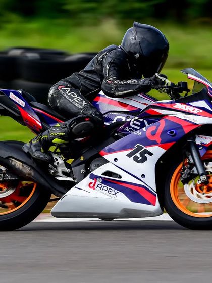 In her first year earning championship points, Poojita AK pilots her race-prepped Yamaha R15 at the Madras International Circuit. This was a breakthrough season, proving her potential.