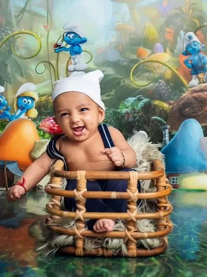 Welcome to the Smurf village. This shot shows how we bring imaginative ideas to life with our creative themed photoshoots, creating a magical world for your little one.