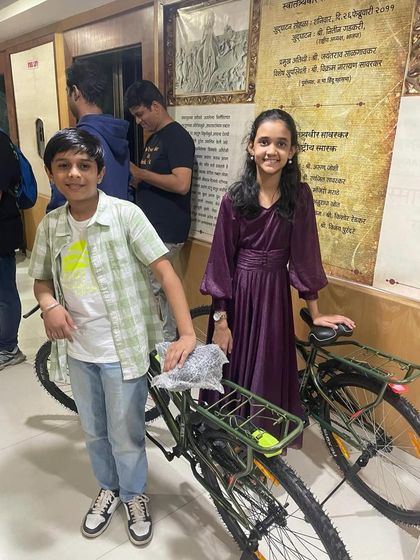 Two of our talented 'Singathon' winners with their prizes. Seeing their dedication pay off is what makes my work so fulfilling.