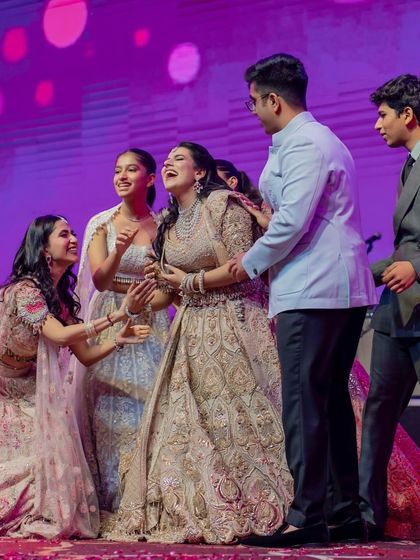 A candid, emotional moment on stage. These unscripted interactions between family members are often the most precious.