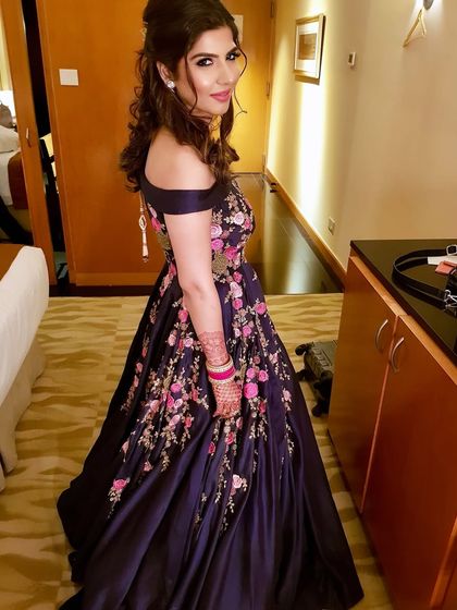 A full-length shot showing off the beautiful floral embroidered gown, perfect for a cocktail or sangeet event.