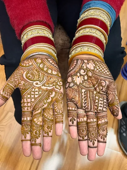 This is a classic, dense bridal design covering the entire palm. The patterns are a mix of paisleys, florals, and checkerboard fills, perfect for a traditional wedding ceremony.