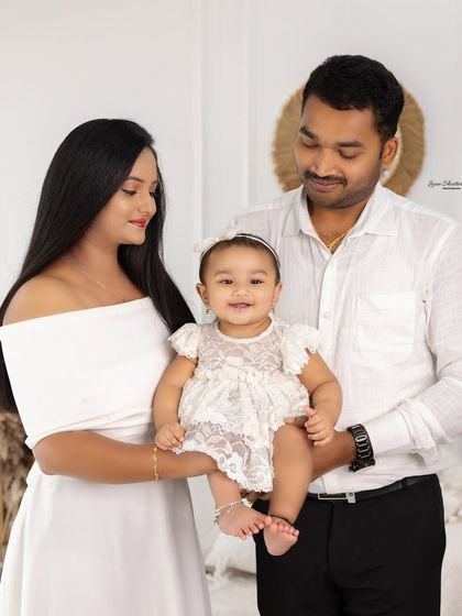 A lovely family portrait where the focus is on the happy baby. We ensure everyone looks their best while keeping the mood relaxed and natural.