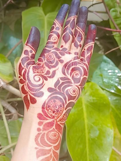 A close-up of a bold, floral stain against a natural green background. The color is deep and vibrant, showing the quality of my homemade paste.