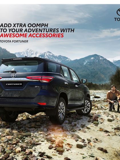 This shot for the Toyota Fortuner campaign connects the vehicle with a man's best friend. The styling is casual and comfortable, perfect for an outdoor adventure, reinforcing the car's go-anywhere capability.