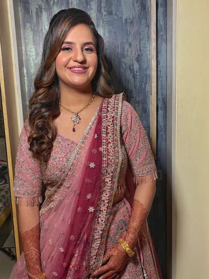 Starting a series of looks with this soft pink engagement style. The makeup complements her radiant glow and elegant outfit, creating a look of pure grace.