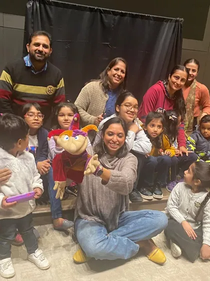 A group photo after a festive Christmas show for Max Pvt Ltd in Delhi. It was heartwarming to see everyone, from the youngest child to the senior staff, enjoying the holiday stories together.