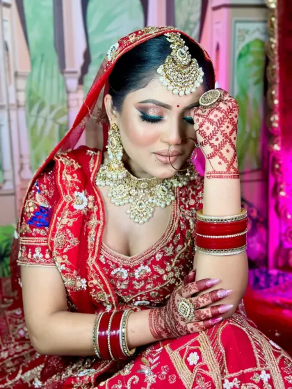 A candid bridal pose. The makeup is set to be picture-perfect from every angle, ensuring the bride looks flawless in all her wedding photos.