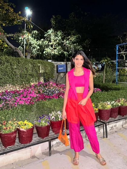 A full-length view of my vibrant Holi outfit. The sleeveless blazer adds a structured element to the crop top and pants co-ord set.