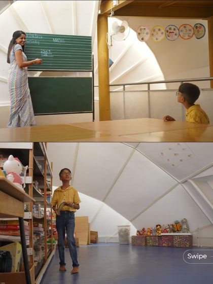 A teacher and student in one of the learning spaces. The open design allows for fluid movement and interaction, reflecting the school's alternative educational philosophy.
