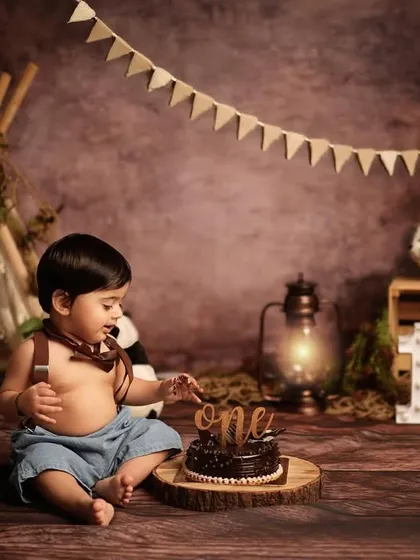 Let the wild rumpus start! A first birthday cake smash is a wonderfully messy and fun way to mark a major milestone. We customize every detail, like this jungle adventure theme, to bring your vision to life.
