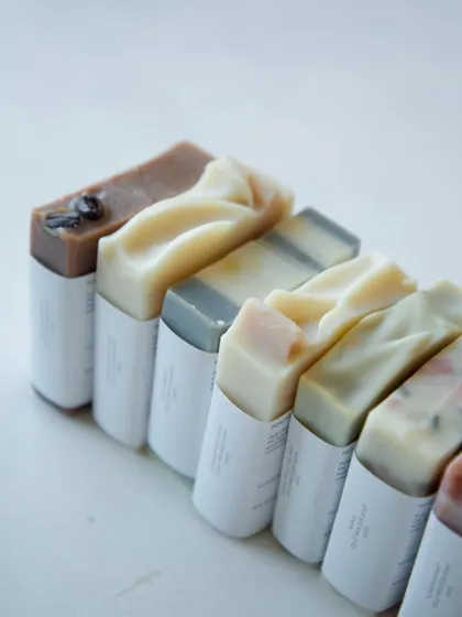 A lineup of the assorted soaps packed for the baby shower, showing the variety of natural colors.