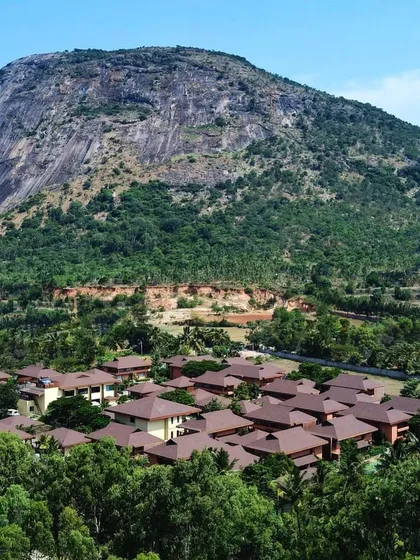 A breathtaking aerial shot of the entire resort, showing the scale of our property and its unique location at the foothills of the magnificent Nandi Hills.