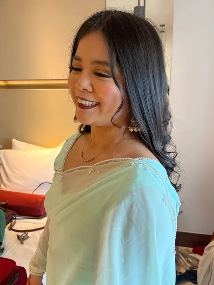 A candid shot showing her beautiful smile and the soft, glamorous makeup look.