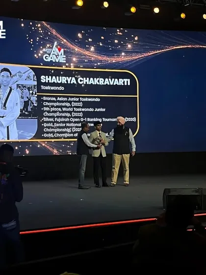 Shaurya on stage receiving his award at the iAMGame Sports Conclave. A proud moment for him and the academy.