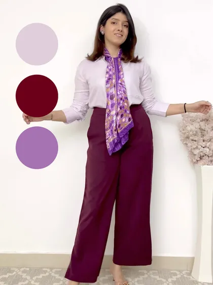 This look explores a tonal purple and burgundy palette. The printed scarf ties the colors of the shirt and trousers together, creating a harmonious and stylish outfit.