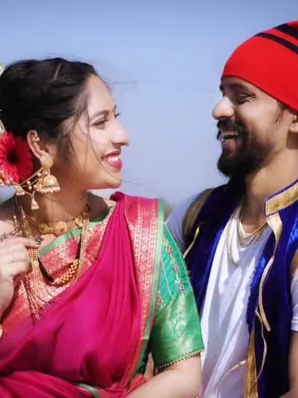 A beautiful pre-wedding shoot look inspired by the Agri Koli culture, set against a scenic waterfront.